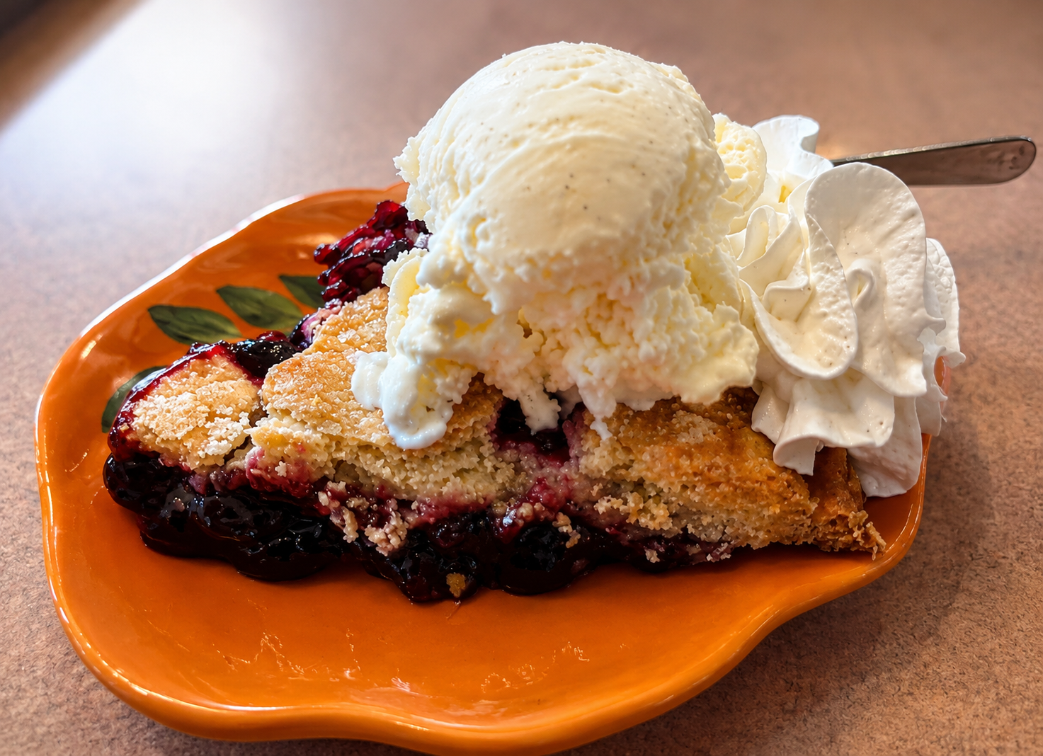 a slice of pie with ice cream