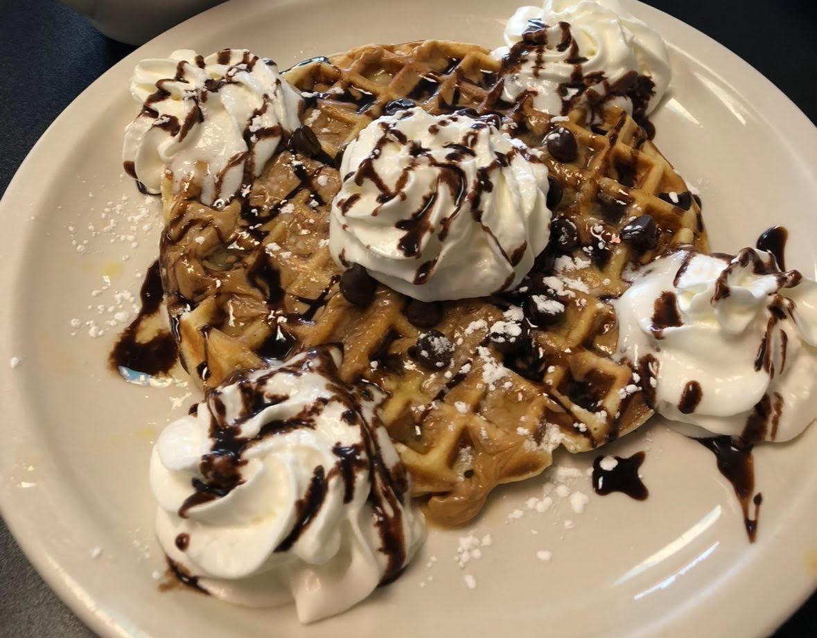 Fresh-pressed waffle with whipped cream